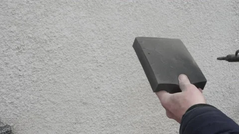 Close-up cleaning of air filter. A service worker removes dust with a compressed Stock Footage 228828810