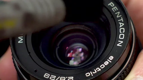 Close-up of cleaning camera lens with brush Video stock 138207788