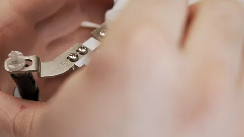 Close-up cleaning of computer's CPU cooling radiator. The service worker removes Stock Footage 105073221