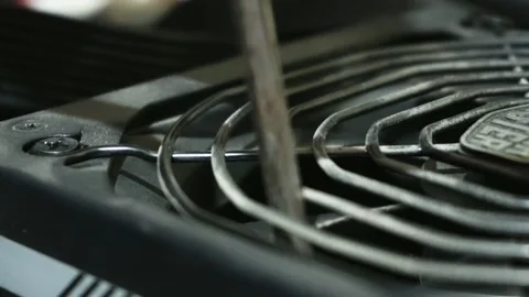 Close-up cleaning a Cooler Master power source with an electric blower Video stock 167245476