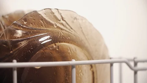 Close up of cleaning plates in dishwasher machine on white background Stock Footage 83593845