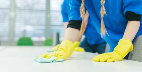 Close-up of cleaning team working in an office 스톡 사진