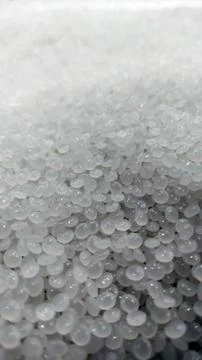 Close-Up of Clear Plastic Pellets  Raw Polymer Granules for Industrial Use Stock Photos