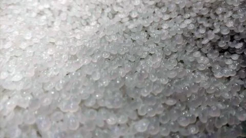 Close-Up of Clear Plastic Pellets  Raw Polymer Granules for Industrial Use Stock Photos