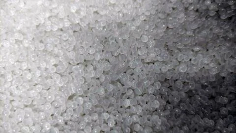 Close-Up of Clear Plastic Pellets  Raw Polymer Granules for Industrial Use Stock Photos
