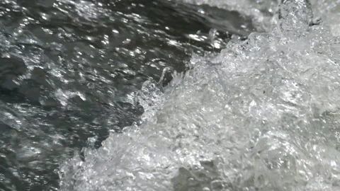 Close up of a clear river splash Stock-Footage 336878341