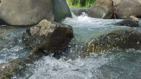 Close up of a clear rocky mountain river Stock Footage 323041388