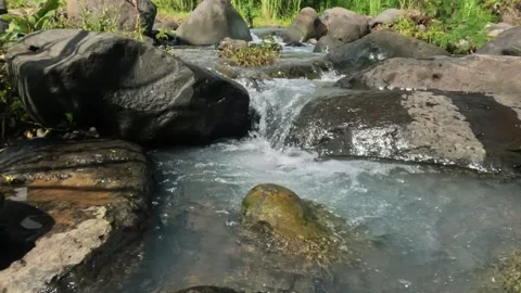 Close up of a clear rocky mountain river Stock Footage 323041389