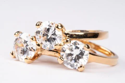 Close up of clear stone gold rings 스톡 사진