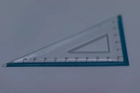 Close-Up of a Clear Triangle Ruler with Measurement Markings Stock Photos