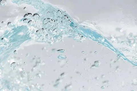 Close-up of clear water with bubbles and flowing movement Stock Photos