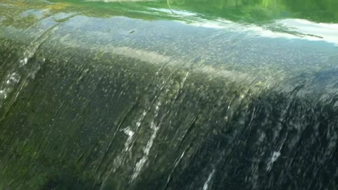Close up of clear water flowing in a river dam Stock Footage 320057071