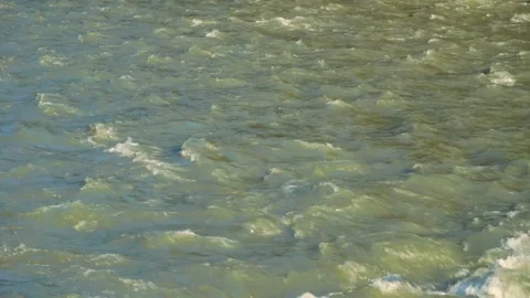 Close-up of clear water flowing in a small mountain river, Stock Footage 166090187