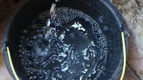 Close-Up of Clear Water Inside a Standard Plastic Bucket for Cleaning Tasks Stock Footage 282332470