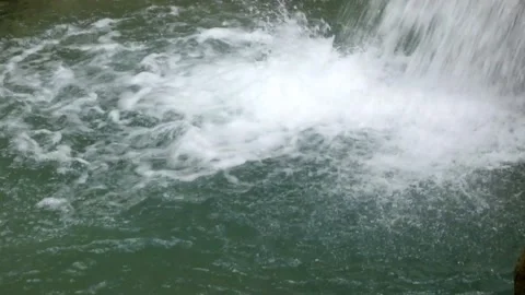 Close up of clear waterfall splashes falling into the river Stock Footage 321325841