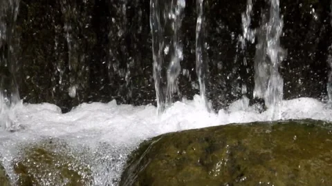 Close up of clear waterfall splashing on rocks Stock Footage 321798698