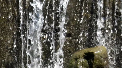 Close up of clear waterfall splashing on rocks Stock Footage 321798703