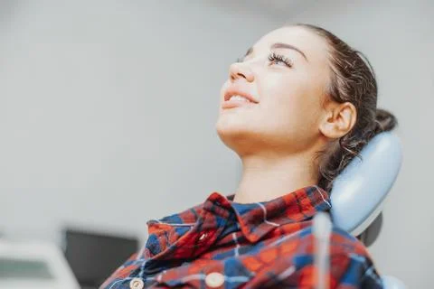 Close up of client smiling while waiting for a stomatologist at dental office. Stock Photos
