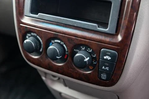 Close-up on climate control buttons in the interior of an old Japanese car in Stock Photos