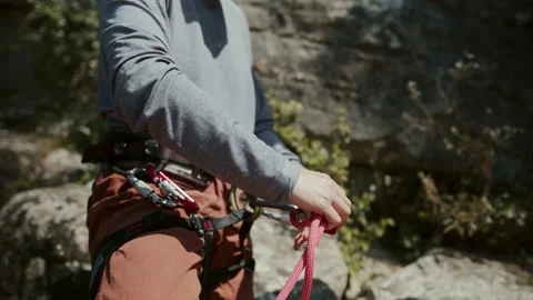 Close-Up of a Climber's Secure Grip on a Rope, with Detailed Focus on the Stock Footage 274054649