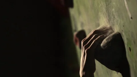 Close-up of a climbing wall, hand grasping a stone. Slow motion Stock Footage 85497526