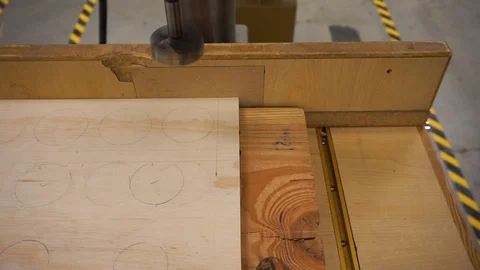 Close-up clip of a drill press in the process of drilling a hole in a small Video stock 92239737