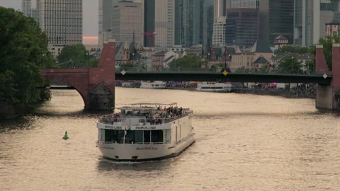 Close clip of a Main River tour boat with the Frankfurt skyline Stock Footage 255653753