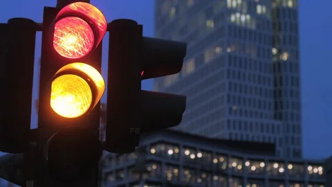 Close up clip of traffic light changing from red signal to green Stock Footage