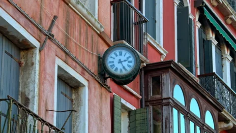 Close up of a clock on the outside of the building in Venice, Italy Stock Footage 304357475