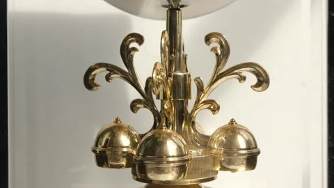 Close up of a clock pendulum moving. Stock Footage 252729170