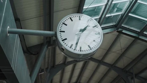 Close up of clock at sky train terminal screen in the back and train is coming d Video stock 311797972