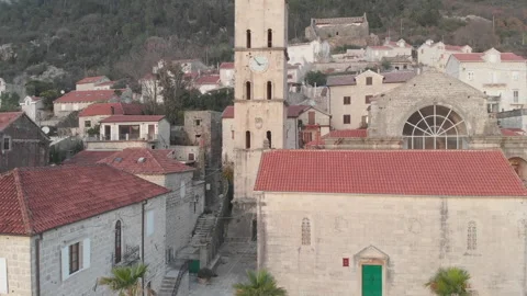 Close-up of the clock tower in Perast, camera movement up Stock Footage 166905389
