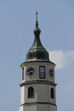 Close-up of clock tower with spire 写真素材