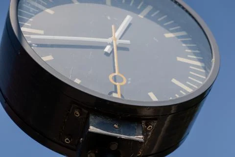 Close-up of the clock at the train station. The second hand moves quickly. Stock Photos