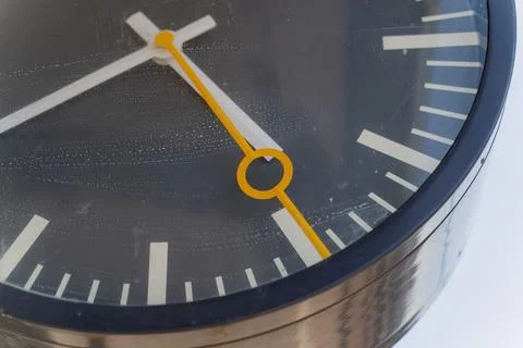 Close-up of the clock at the train station. The second hand moves quickly. Stock Photos