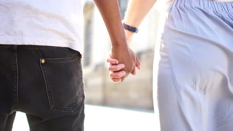 Close-up of closed hands. Multiracial group of people standing on the street Stock Footage 133605495