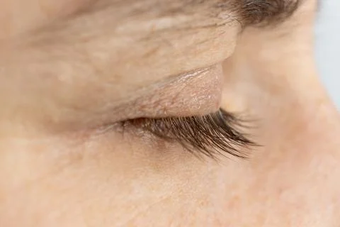 Close up of closed human eye showing skin texture and lashes Stock Photos