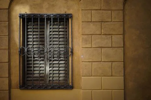 Close-up on a closed window with bars Stock Photos