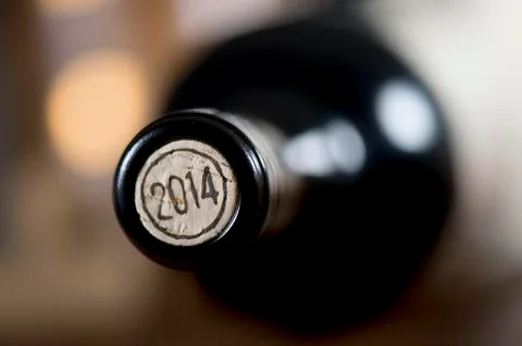 Close-up of closed wine bottles lying on blurry background 스톡 사진