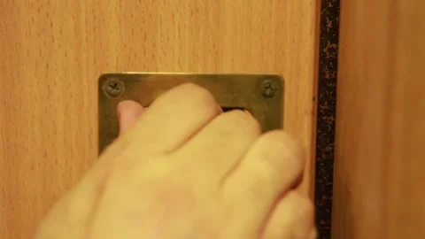 Close-up of closing the door on a brass latch Stock Footage 151105365