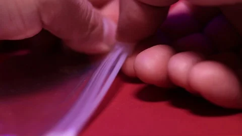 Close-up of closing ziplock of biohazard plastic bag. Stock Footage 113055015