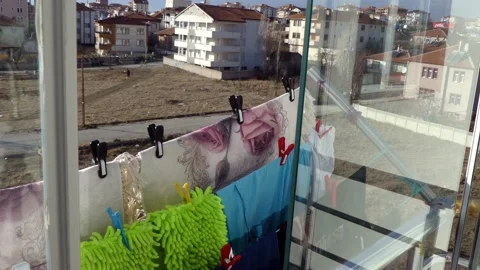 Close-up of clothes drying on a balcony, clothes hanging on a clothesline wit Stock Footage 166401297