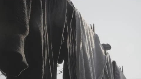 Close up of clothes hanging on clothesline Stock Footage 140622630