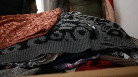 Close up of clothing piling up on bedroom bed - hoarding concept Stock Footage 101487906