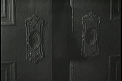 Close-up of clothing stuck between wooden doors Stock Footage