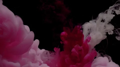 Close-up of a cloud of pink and white paint mixed under water Stock Footage 114319802
