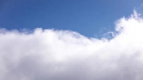 Close Up of Clouds Flowing Across Blue Sunny Sky Stock Footage 137774788