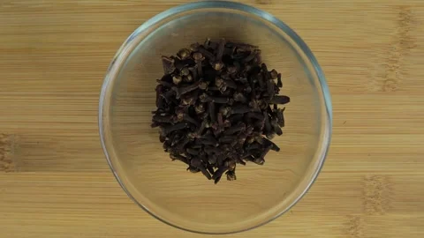 Close up of cloves sprinkled from above Stock Footage 264892616