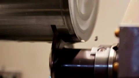 Close up of a cnc lathe machine cutting metal cylinder in the workshop Stock Footage 332424396