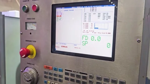 Close-up of CNC Machine Control Panel with LCD Screen and Emergency Stop Button Video stock 336242061